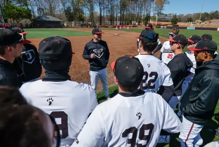 Rucker Taylor team huddle Marist 2023