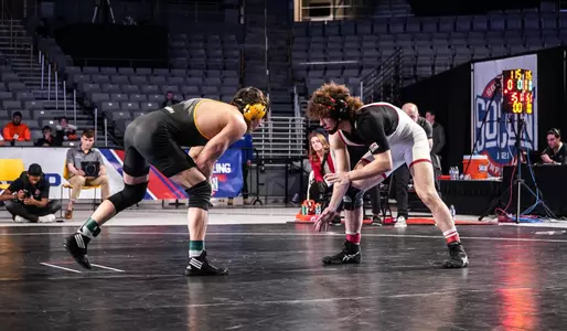 Tanner Peake wrestles in the SoCon 157-pound final