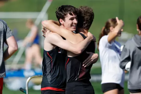 Owen Drometer and Jack Muldoon exchange a hug following the 800m at the VertKlasse Meeting
