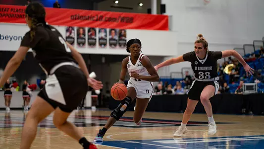 TomisiTomisin Adenupe dribbling at 22-23 A-10 WBB Tournamentn Adenupe dribbling at 22-23 A-10 WBB Tournament