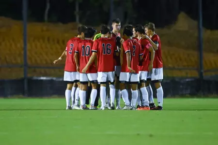 Men's soccer huddle