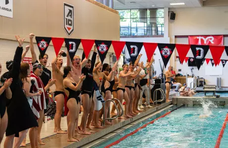 swimmers celebrate 23 vs Queens