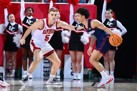 Grant Huffman guarding Dayton in A-10 opener.