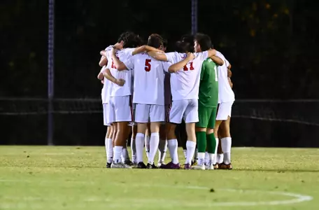 Men's soccer huddles during an A-10 match against No. 25 Dayton