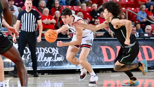Connor Kochera drives against William Peace
