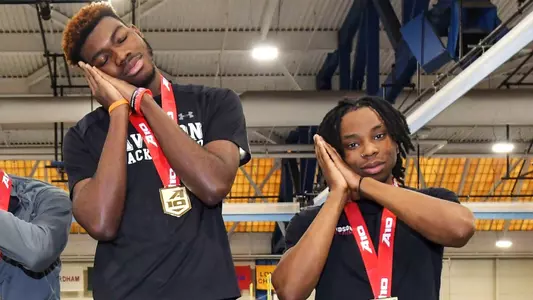 Jayden Smith and Isaac Bynum pose on the podium after medalling at the 2023 A-10 Indoor Championships