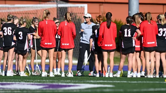 WLAX team huddle 2024