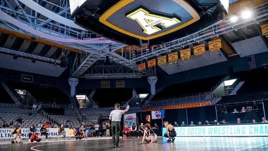 Tanner Peake wrestles in the 2023 SoCon finals