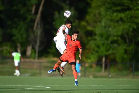 Ayman Maadir heads a ball against Campbell