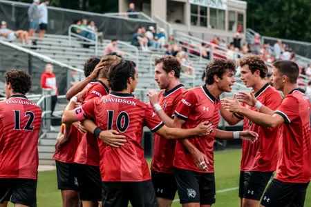 Men's soccer celebrates a goal against UNCG
