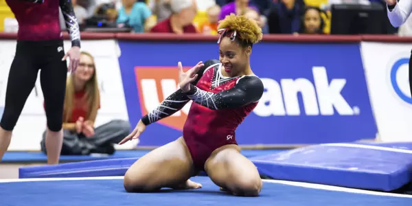 McGee scored a near-perfect 9.975 on floor to help win her third straight all-around title.