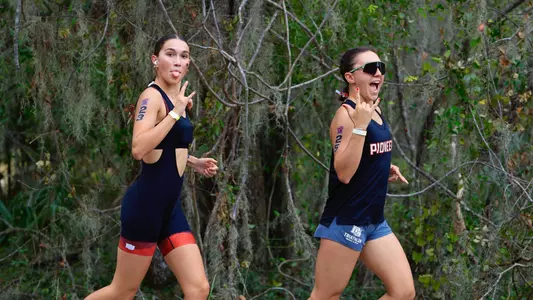 Sisters Beatrice Normand (left) and Clara Normand (right) warmup together before the 2024 Collegiate Triathlon National Championships in Clermont, Florida, on Nov. 9, 2024.