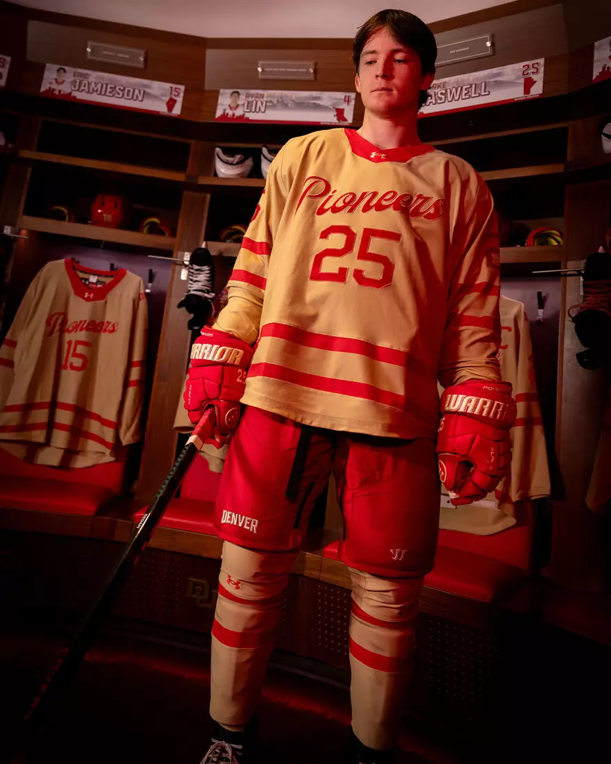 The Denver Pioneers hockey team reveals a new 'Golden Age' jersey to be worn on Friday, October 16, 2026 for the faceoff against the No. 2 Michigan and the 11th National Championship Banner.