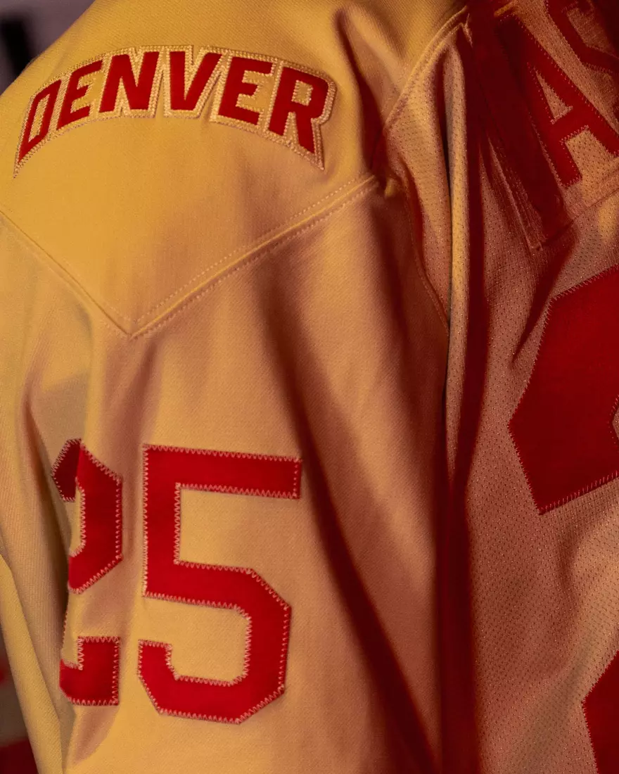 The Denver Pioneers hockey team reveals a new 'Golden Age' jersey to be worn on Friday, October 16, 2026 for the faceoff against the No. 2 Michigan and the 11th National Championship Banner.