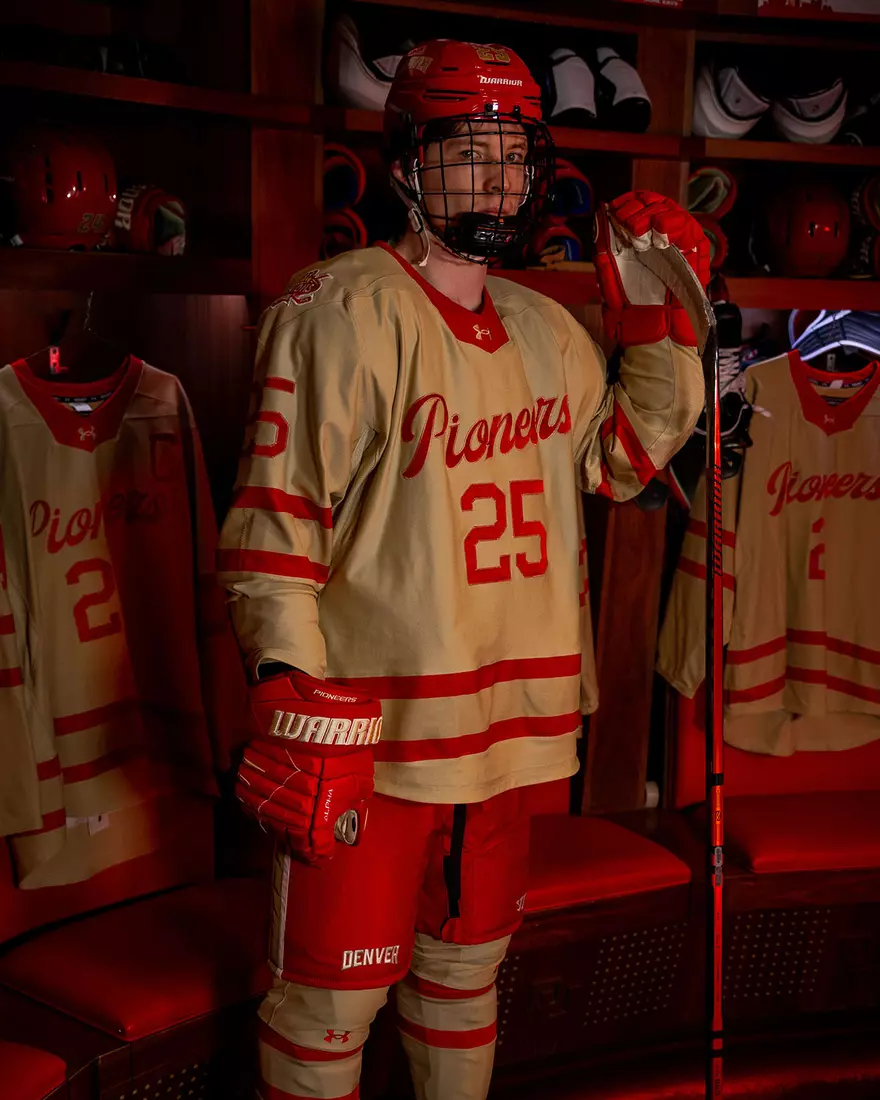 The Denver Pioneers hockey team reveals a new 'Golden Age' jersey to be worn on Friday, October 16, 2026 for the faceoff against the No. 2 Michigan and the 11th National Championship Banner.