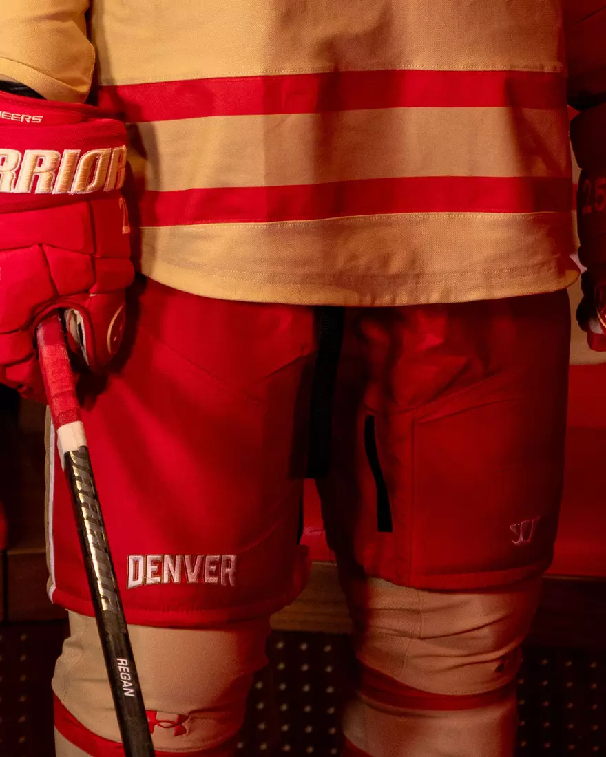 The Denver Pioneers hockey team reveals a new 'Golden Age' jersey to be worn on Friday, October 16, 2026 for the faceoff against the No. 2 Michigan and the 11th National Championship Banner.