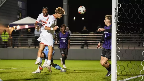 Erik Collins heads a goal in at Portland.
