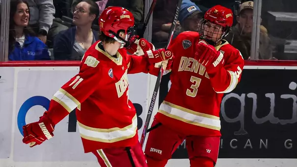 Denver hockey players Cale Aschroft and Daxon Rudolph celebrate on October 2, 2026 during the game at Alaska Anchorage.