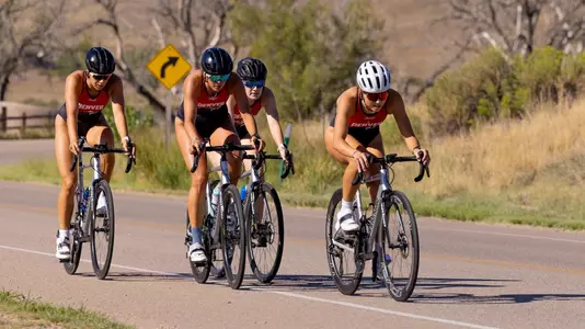 Lucrezia Gowdy leads the bike peloton during DU's intrasquad super sprint on August 26, 2026 at Chatfield Lake State Park in Littleton, Colorado.