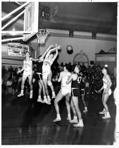 All-American Dick Heise pulls down rebound in 1957.