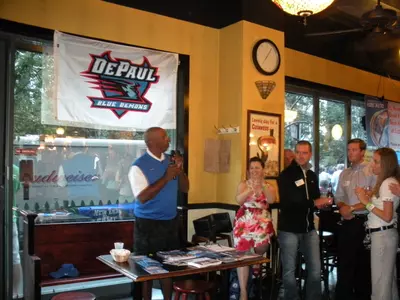 Oliver Purnell greeted the crowd at Lizzie McNeill's during the second stop of the Coaches' Caravan.