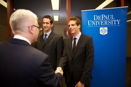 Mario Stula (left) and Matijia Palinic shake hands with Croatian President Josipovic on May 2 in the loop