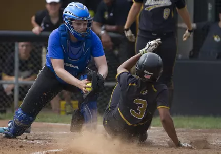 Marla Mathews and her teammates cut down two Missouri runners at home plate in Sunday's NCAA Regional finals.