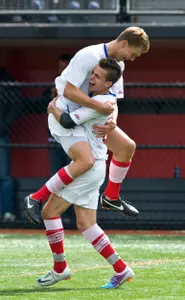 Zach Forbes leaps onto Thiago Ganancio after Ganancio scored the third goal in a 4-0 win over Northwestern.