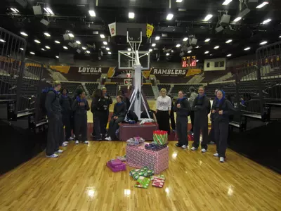 The women's basketball players at DePaul decided to play Santa Claus this Christmas