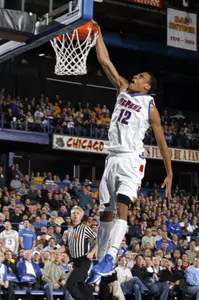 Cleveland Melvin scores two of his team-leading 22 points in Monday's night's 89-76 loss to No. 18/19 Marquette.