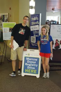 Kelly Pickering poses alongside former men's basketball player Mario Stula at DePaul's bone-marrow donor drive.