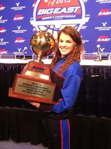 Anna Martin with the Scholar-Athlete trophy after the press conference on Friday.