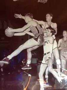 Jack Allen teams up with George Mikan against Marquette.