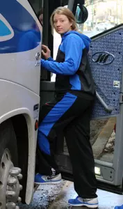 Megan Rogowski boards the bus Thursday morning as the Blue Demons depart for the NCAA tournament.