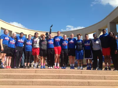 Jessica January and her teammates pose for a photo at one of the memorials in Normandy, France