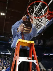 Head Coach Doug Bruno cuts down the net after the Blue Demons won their second consecutive BIG EAST Tournament.