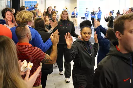 Blue Demons high-five fans during Wednesday's NCAA tournament send-off.