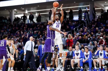 Femi Olujobi shoots a three at Northwestern