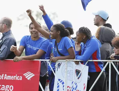 Members from track & field cheer on Blue Demons