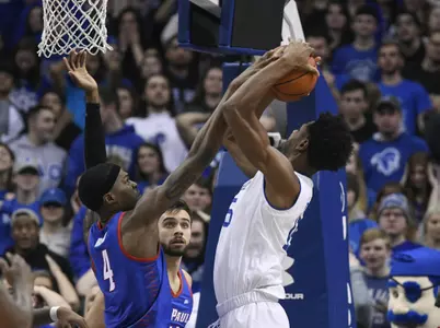 NEWARK, NJ - JANUARY 19:  Paul Reed #4 of the DePaul Blue Demons blocks the shot of Taurean Thompson #15 of the Seton Hall Pirates at Prudential Center on January 19, 2019 in Newark, New Jersey. (Photo by Porter Binks)