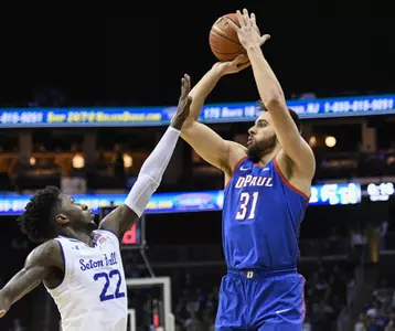 NEWARK, NJ - JANUARY 19:  Max Strus #31 of the DePaul Blue Demons shoots over Myles Cale #22 of the Seton Hall Pirates at Prudential Center on January 19, 2019 in Newark, New Jersey. (Photo by Porter Binks)