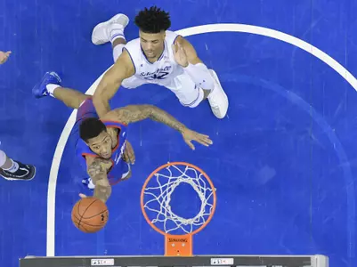 NEWARK, NJ - JANUARY 19:  Devin Gage #3 of the DePaul Blue Demons shoots over Darnell Brodie #32 of the Seton Hall Pirates at Prudential Center on January 19, 2019 in Newark, New Jersey. (Photo by Porter Binks)