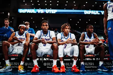team sitting on bench