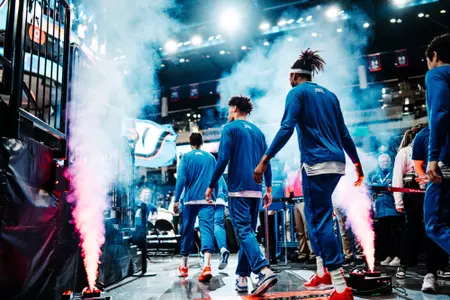 team walks out of tunnel