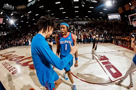 javan johnson celebrates on court following a win at loyola