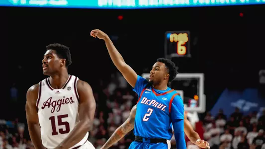 chico carter jr. makes a three pointer