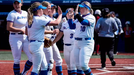 Nicole Sullivan and Riley Pool high five