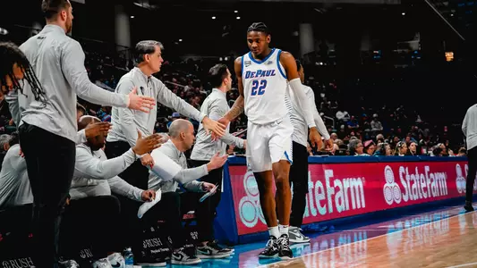 elijah fisher high fives coaches on bench
