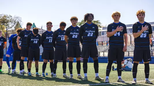 Men's Soccer stands for the anthem
