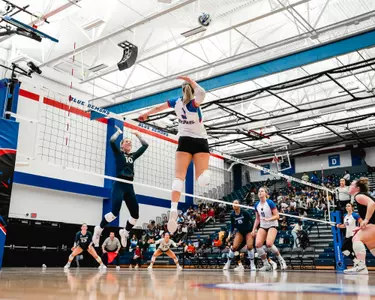 Jill Pressly attacking volleyball in the air